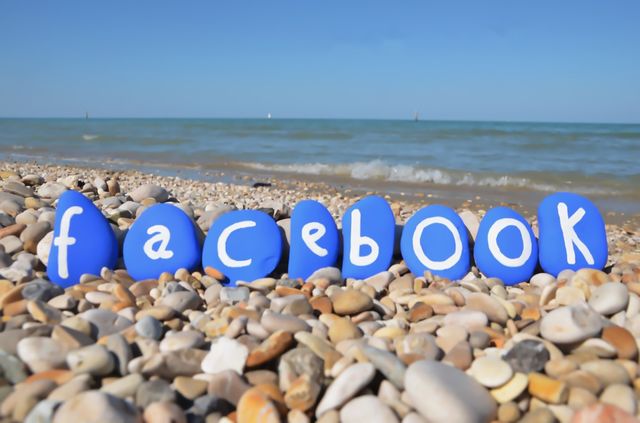 Facebook conceptual stones composition on the beach