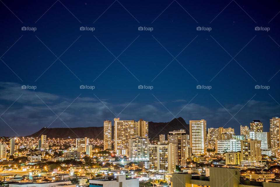 Illuminated of cityscape at night, Honolulu, Hawaii