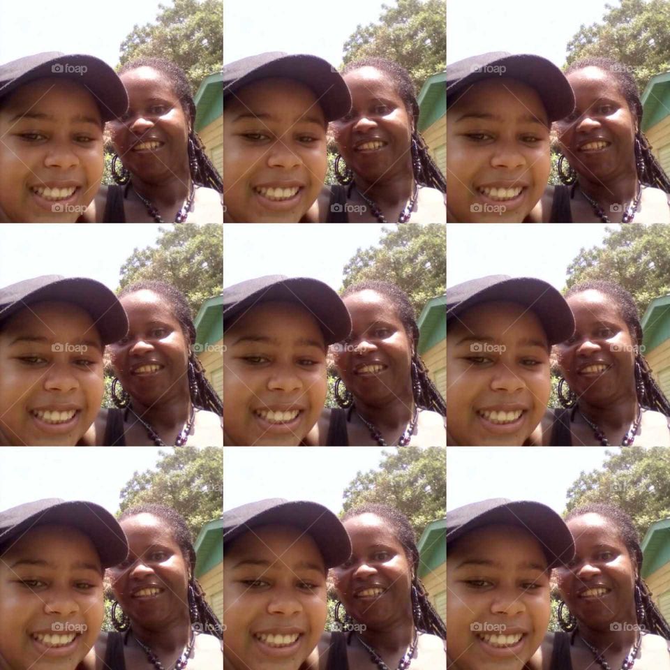 many different faces but just one beautiful picture of mother and daughter experimenting with a new app very cool .