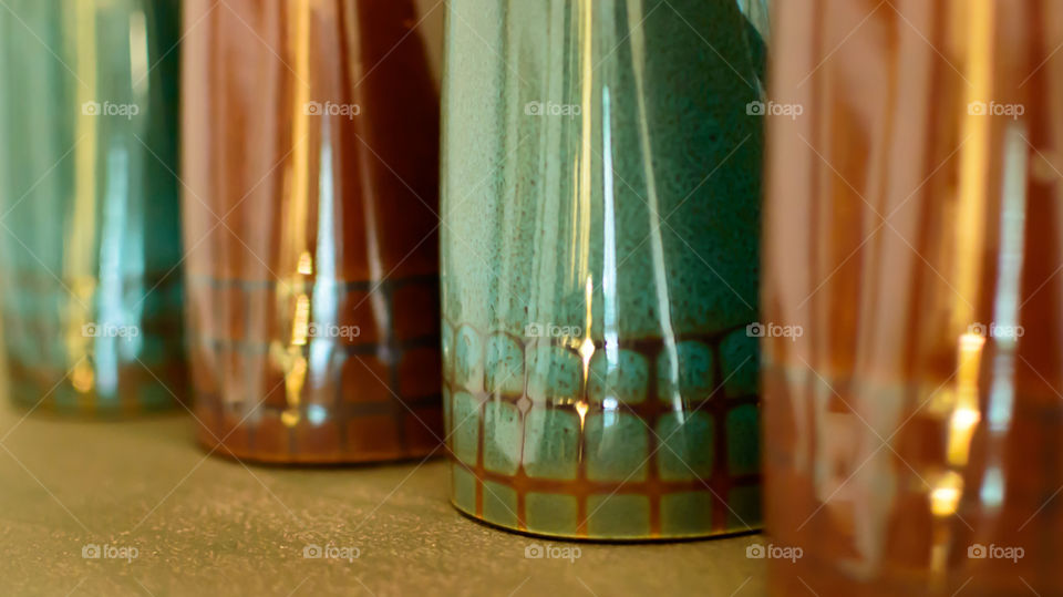 Group of green and brown coffee mugs