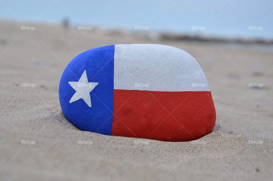 Texas flag on a stone