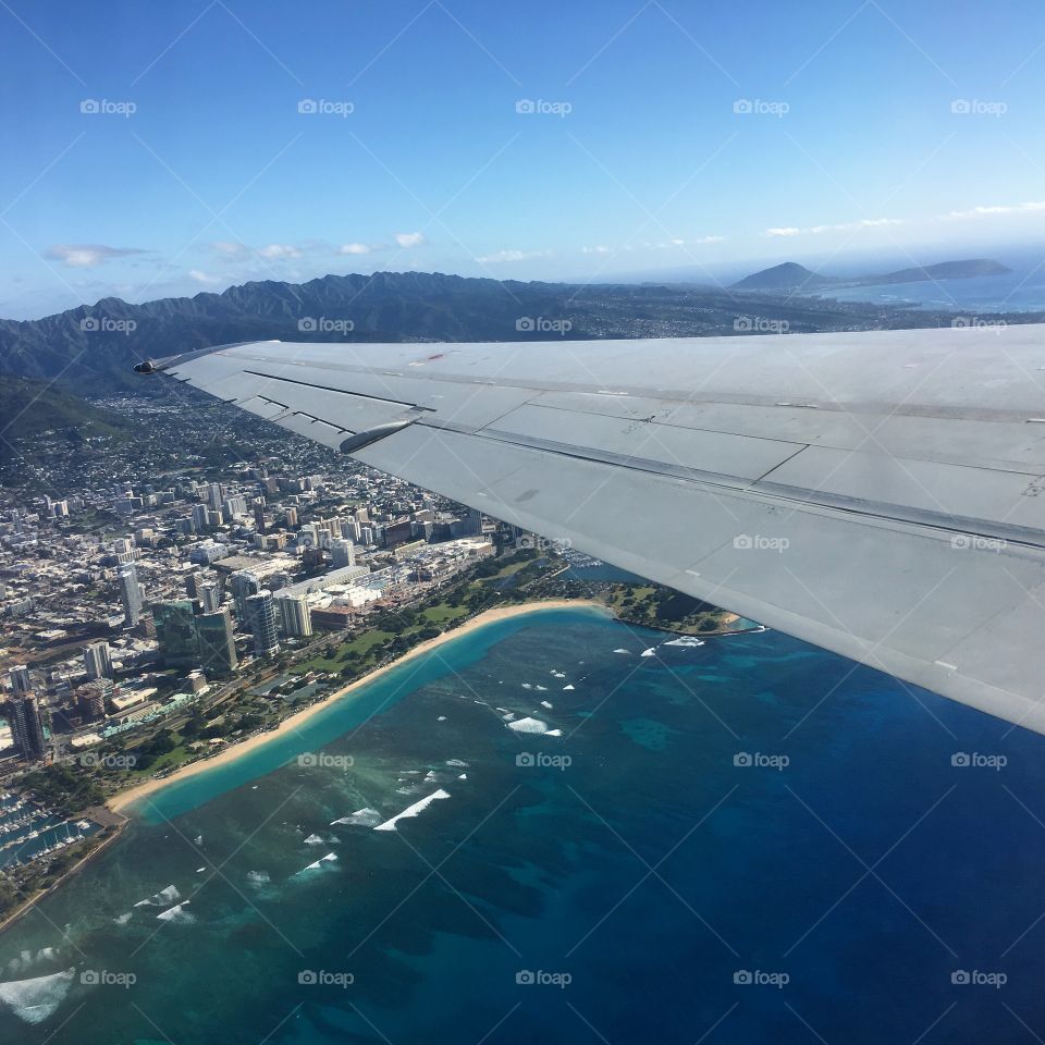 The City of Honolulu and Ala Moana Beach View from the airplane 