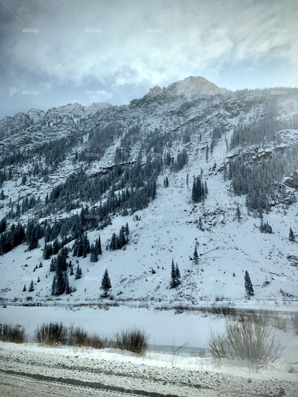 Snow covered Colorado mountains in autumn.