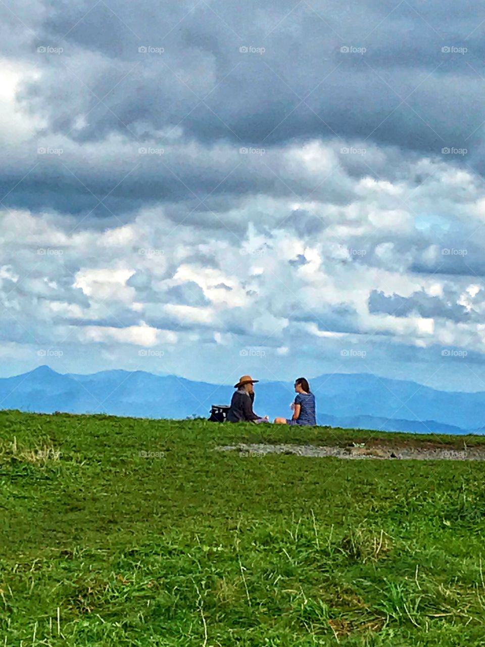 Picnic at the hill top with awesome mountain range view