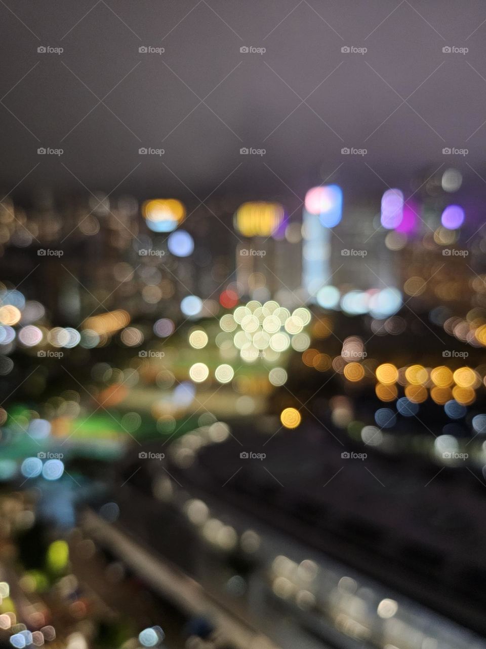 Blurry view of the Hong Kong Victoria Park on a rainy night