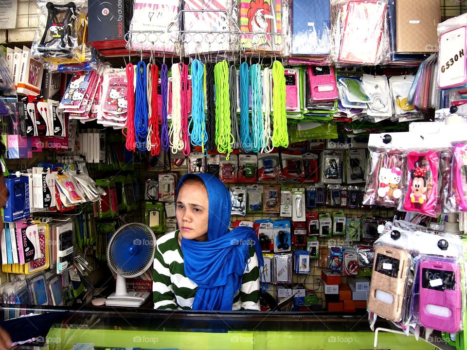 a lady in her cellphone accessories store