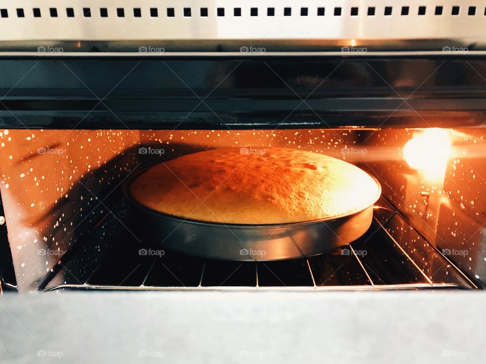 view of cake baking in the oven