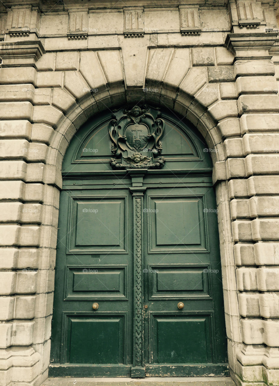 Entrance of an old historical building in Antwerp, Belgium.