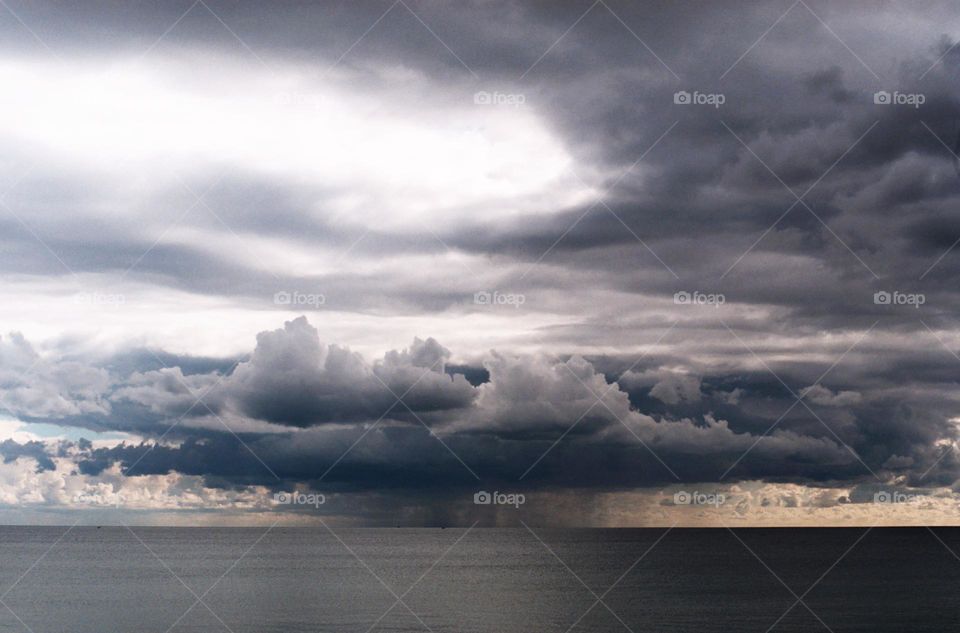 Storm over the sea in Brighton. You can see the clouds raining over the sea