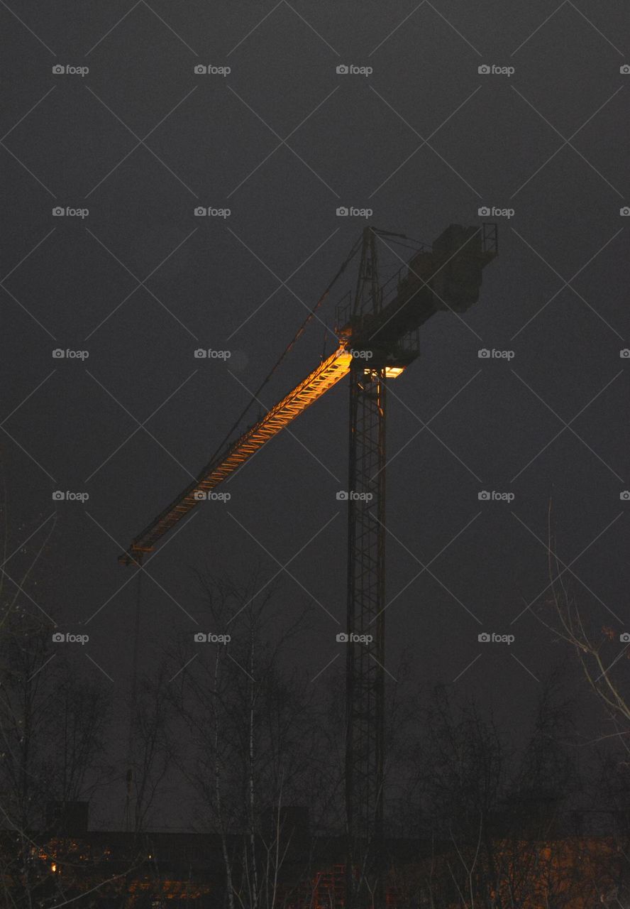 crane building in the night and light