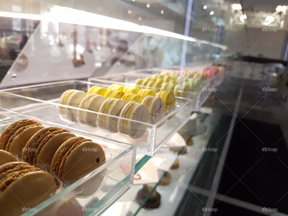 Lineup of macaroons in a glass counter