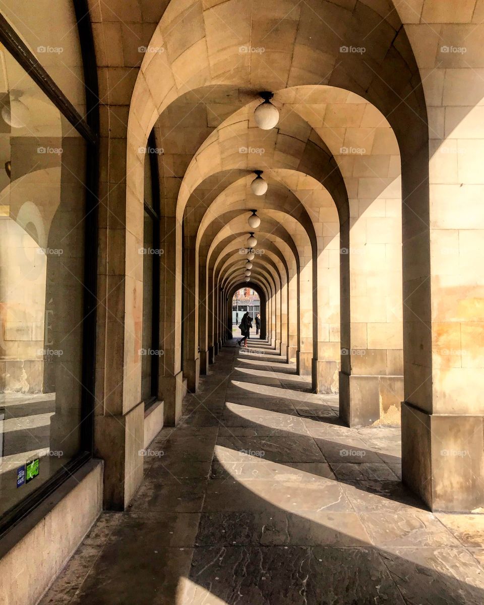 Taken in Manchester, ah Library Walk. The photograph shows the column walkthrough next to the library, the shadows and lighting cast an almost optical illusion.