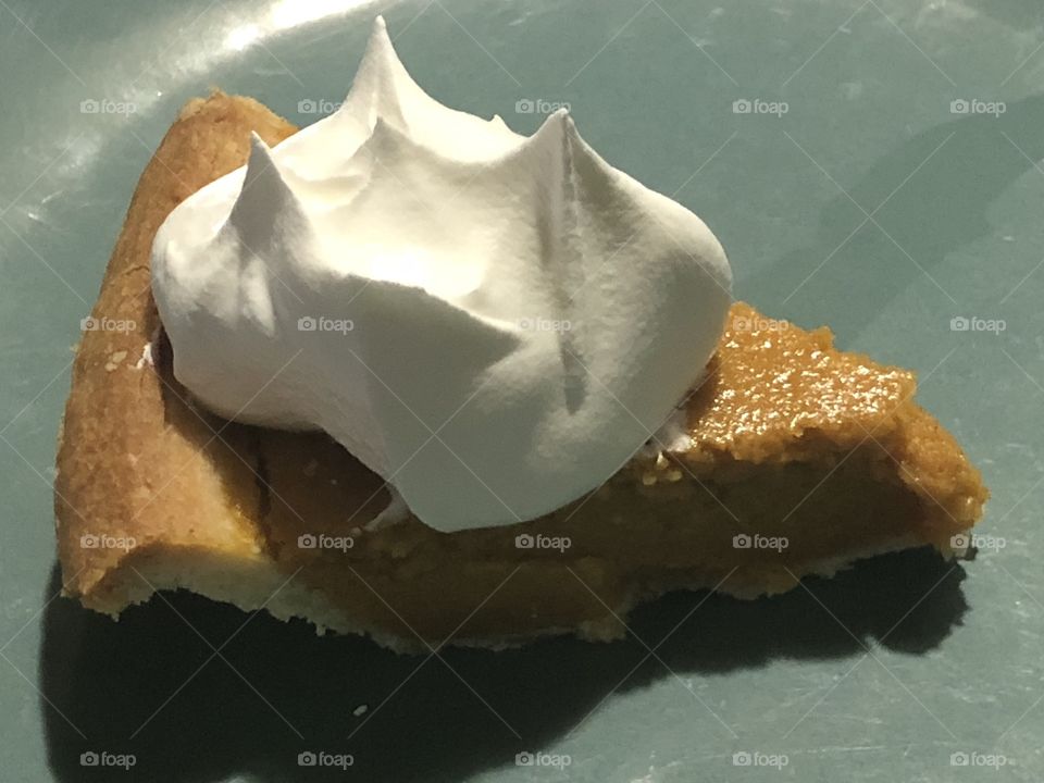 Pumpkin pie with whip cream