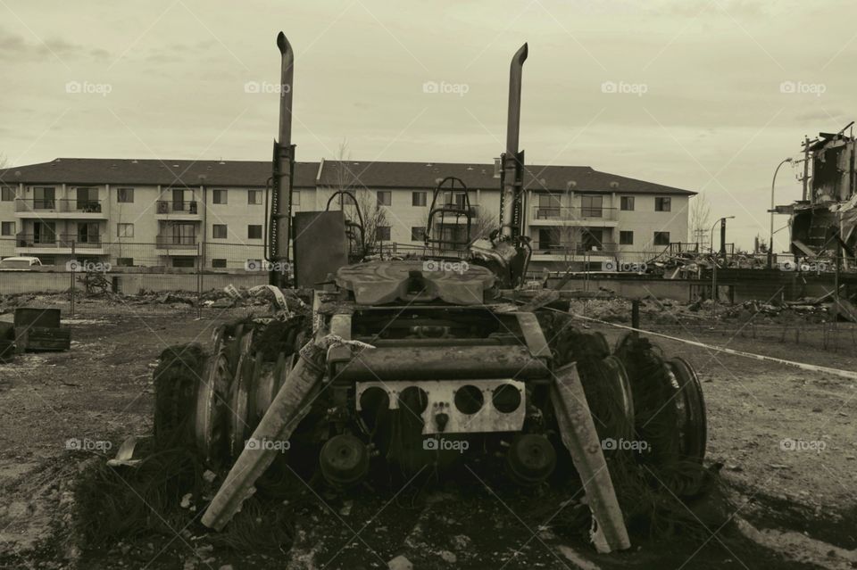 the frame of a tractor burnt after a home fire
