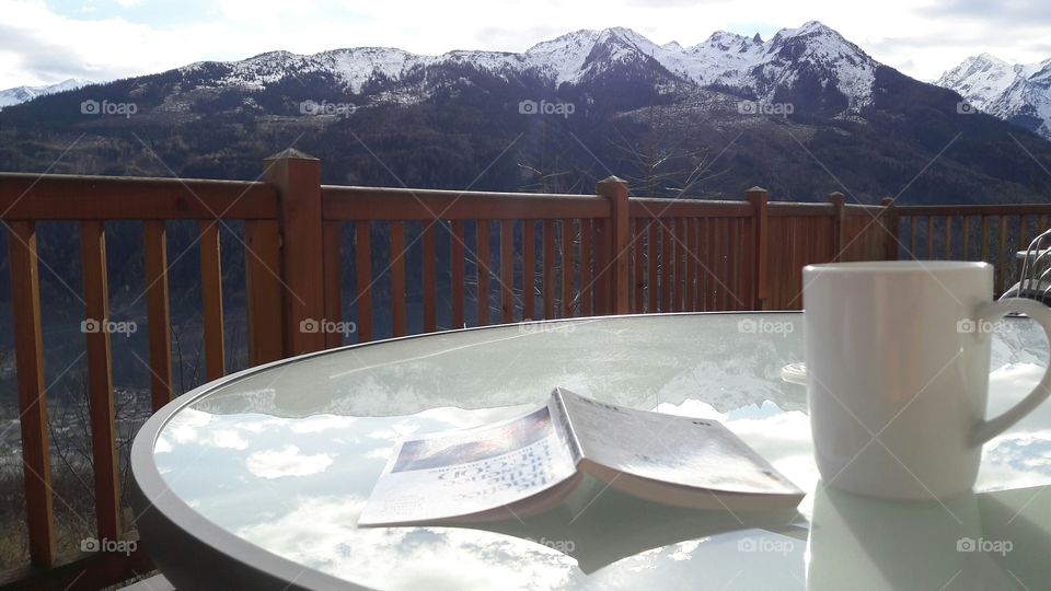 Coffee and a book in the mountains of austria