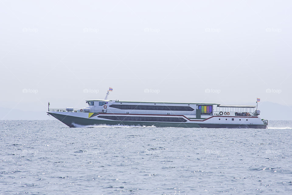 ferry boats transfers visitors in the sea at Koh Kood, Trat in Thailand.