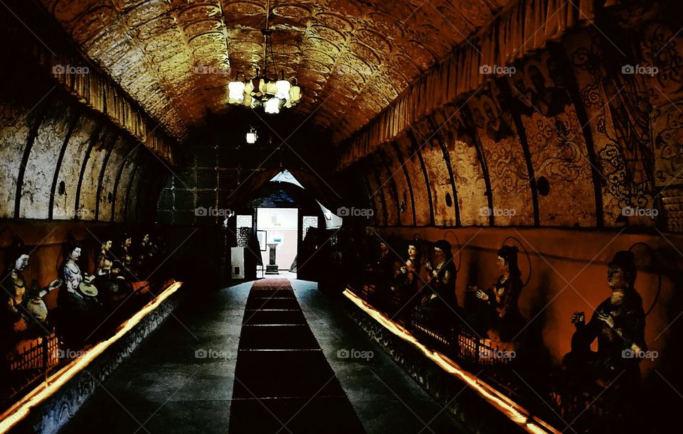 Tunnel of gods. An underground tunnel guarded by Buddhist gods. This tunnel was built in the 8th century in the city of Chang'an (Xi'an)