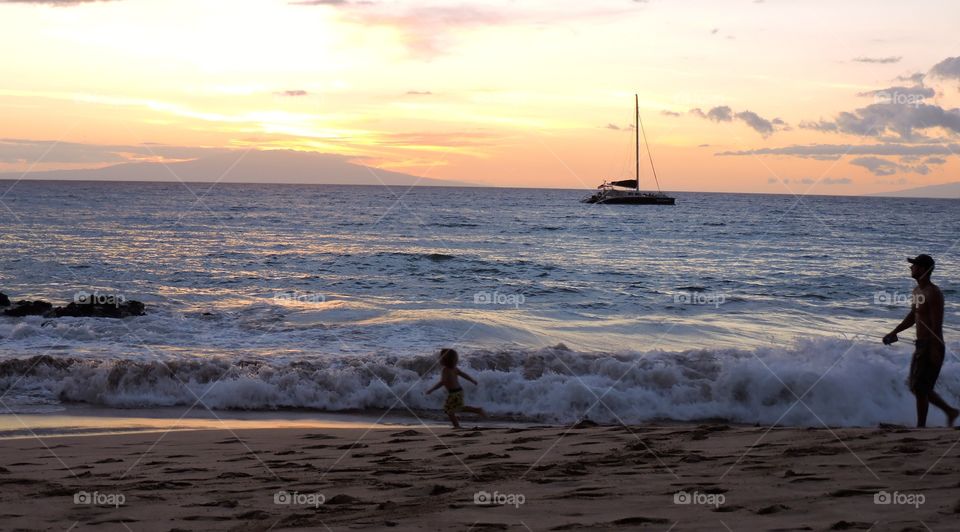 Boat at sail. Sunset sail in Maui