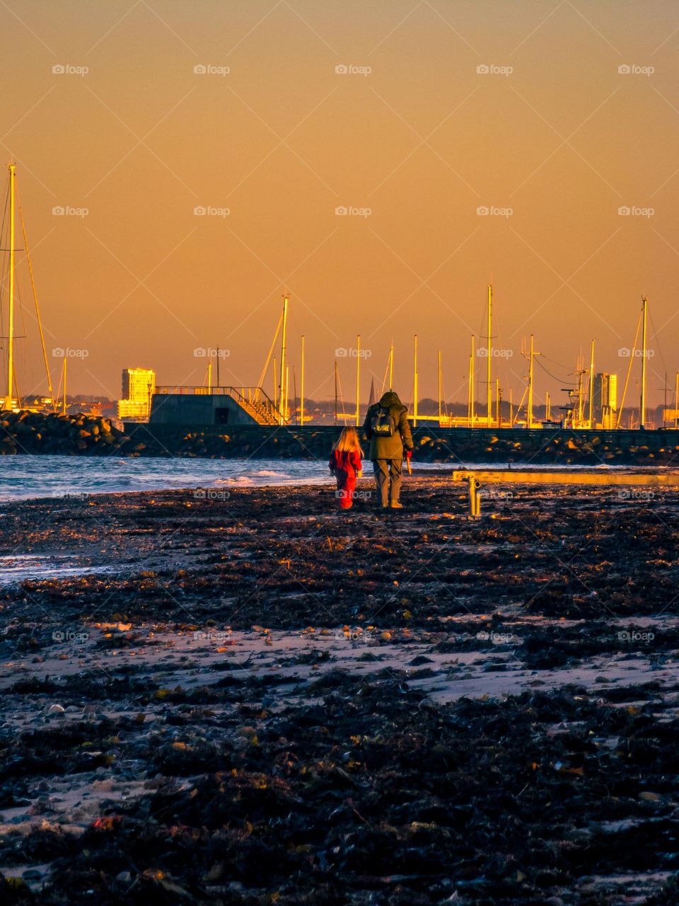 waking on the beach during sunset