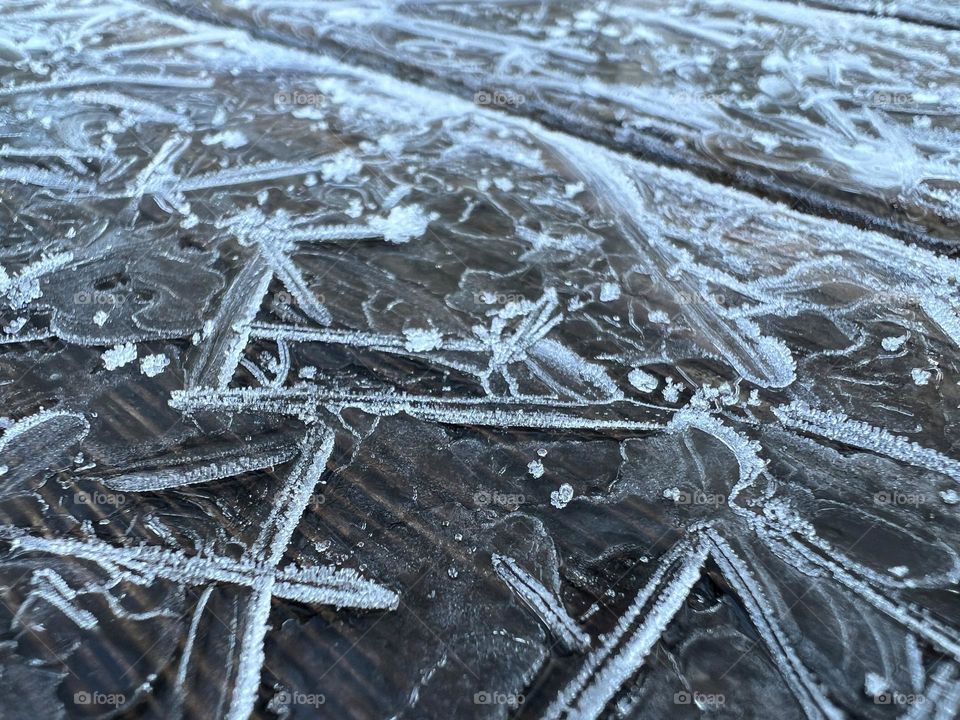 Ice on a bench in switzerland