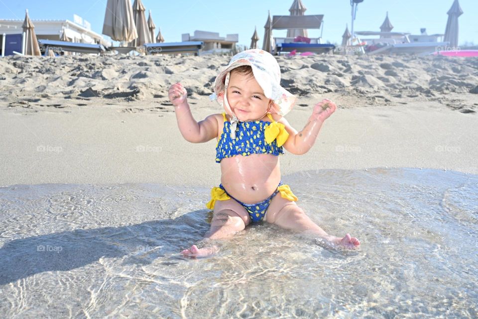 happy little girl at the sea