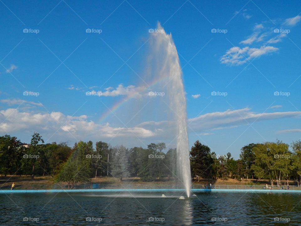 fountain and rainbow in the park