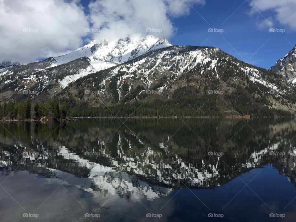 Mountain peaks reflected in a lake. 