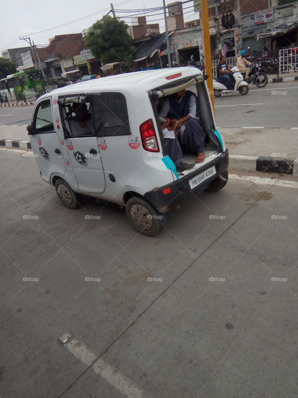 a little car on a road number NH-7.