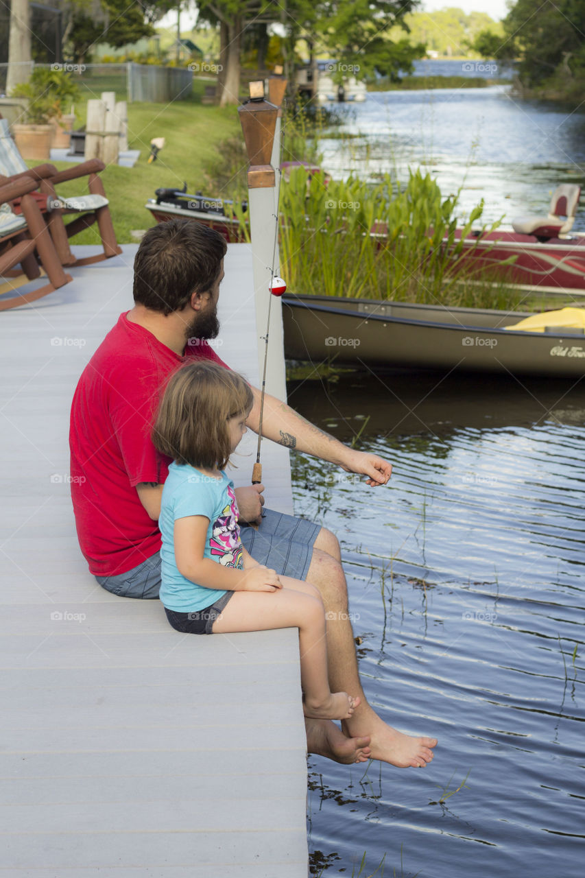 sitting on the dock. fishing with daddy memorial day weekend