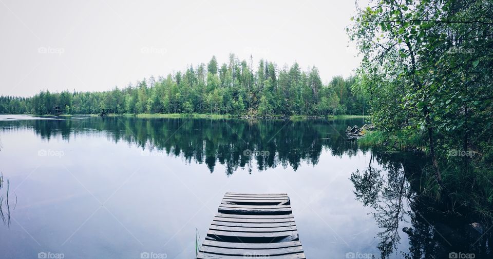 Reflection of trees on lake, Finland