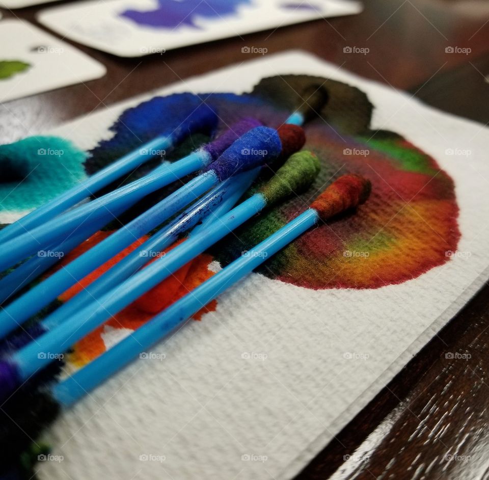 Colorful cotton swab on tissue paper