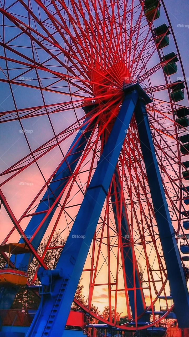 huge Ferris wheel at sunset