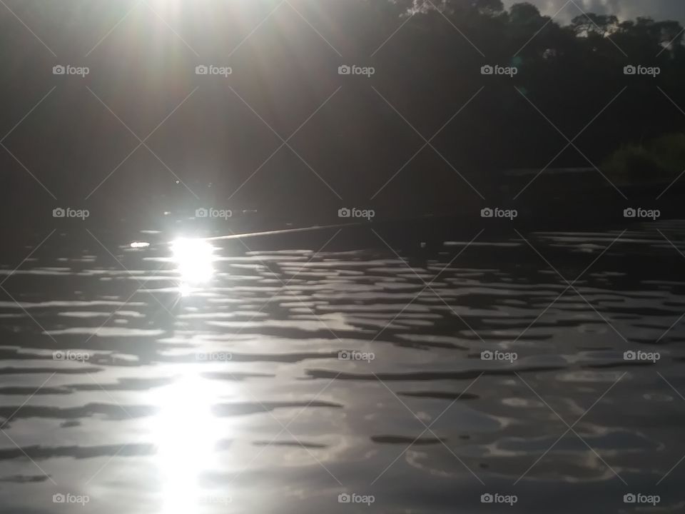 this is another really great shot of the sun reflecting off of the water at the Docks at Angleton Texas