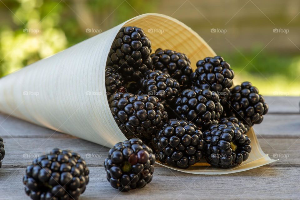 wooden bag and blackberries