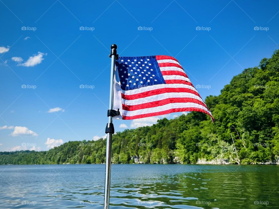 The United States of America’s flag flying from a boat on Lake Cumberland in Kentucky 