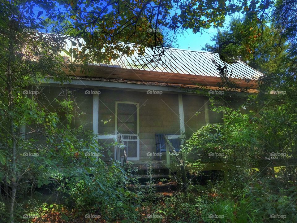 Abandoned behind a gate and in the woods 