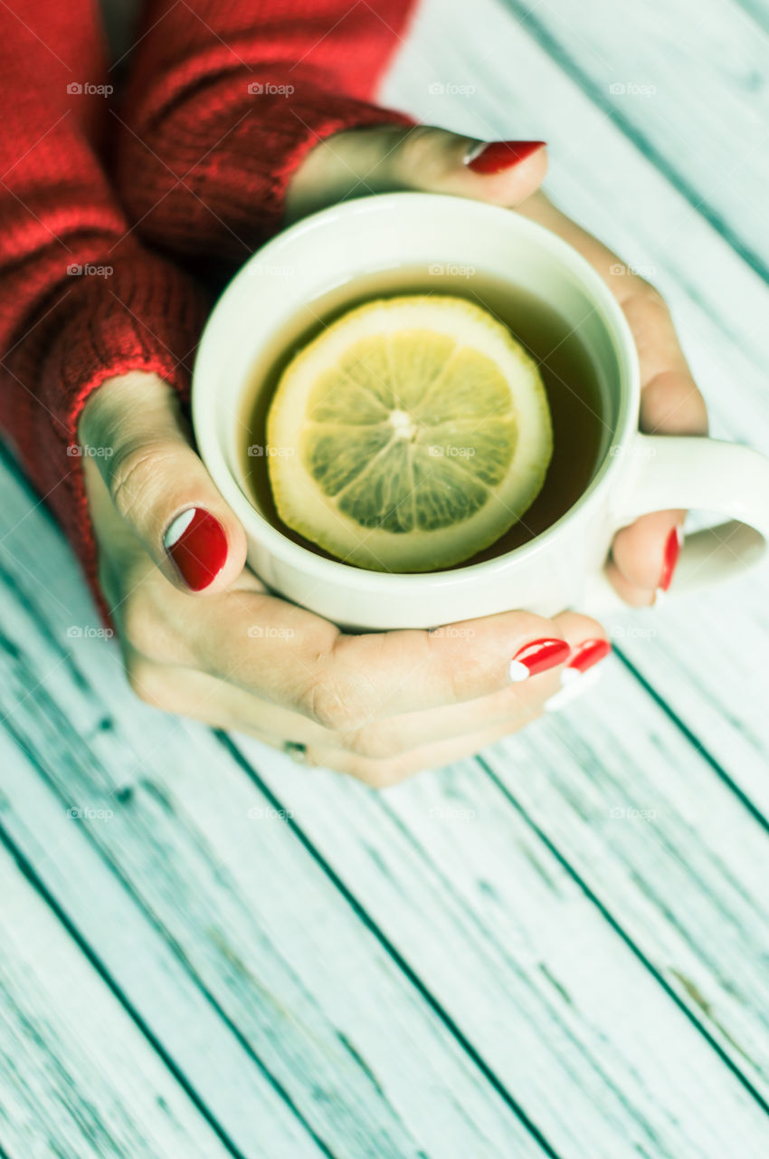 woman hand with cup of tea