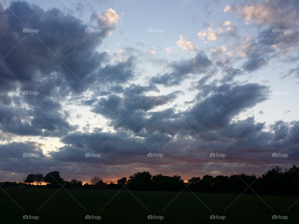 Blue & Orange Cloud Filled Sunset