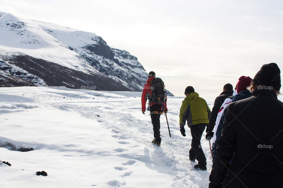 People walking on the snowy land