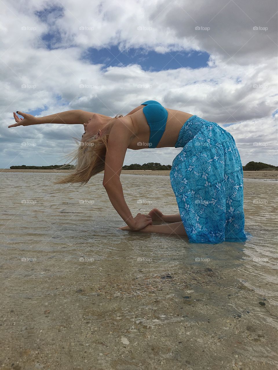 Woman dancing at beach