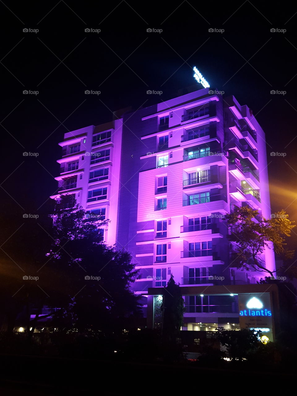 Building illuminated with pink lights at night