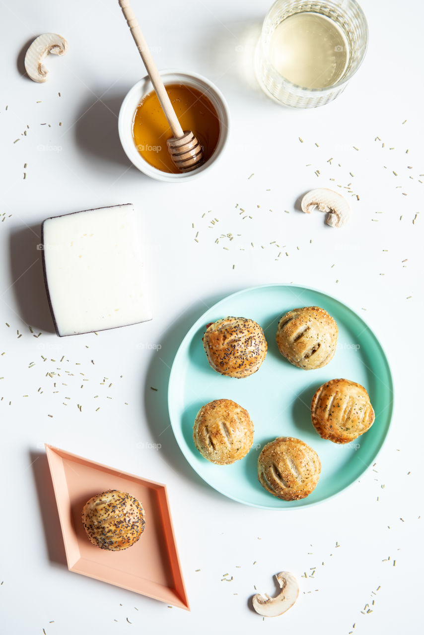 Hard light flat lay of a plate of appetizers and ingredients 