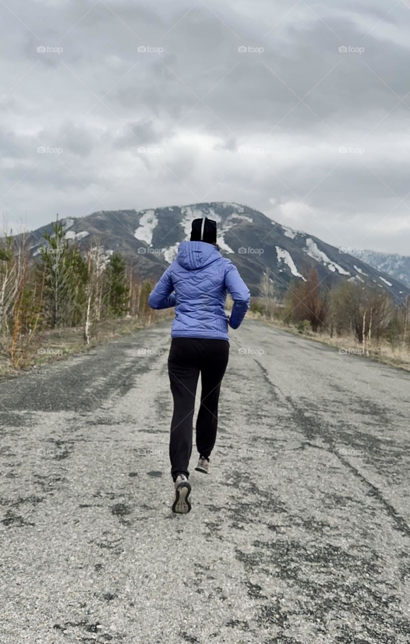 woman running on the road