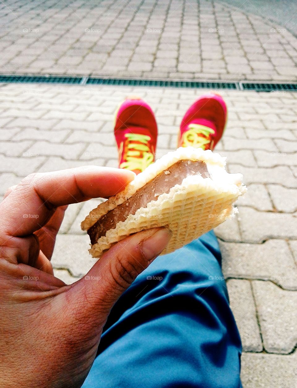 eating ice on the street in sunny day