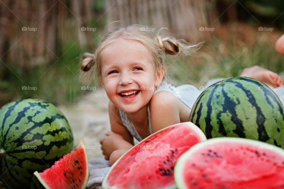 Little Caucasian girl feeling happiness outdoor 