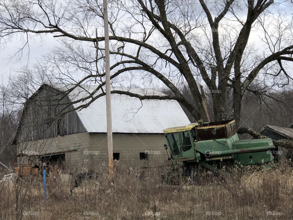 Barn, tractor, and tree