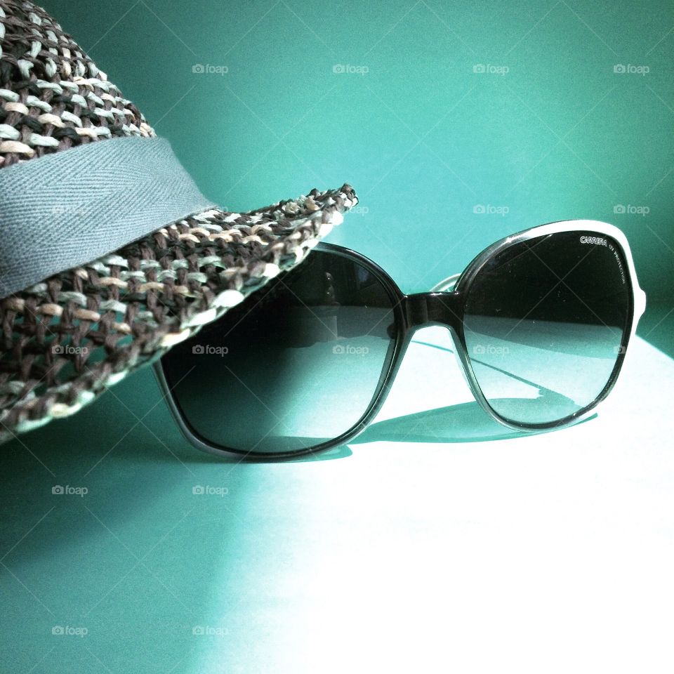 Turquoise hat and glasses. Turquoise hat and glasses close up