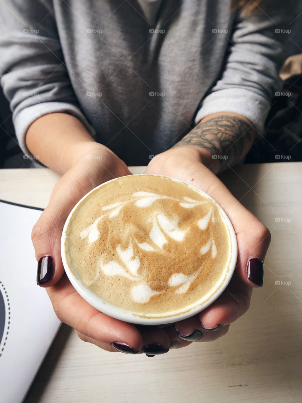 Girl is holding a coffee cup