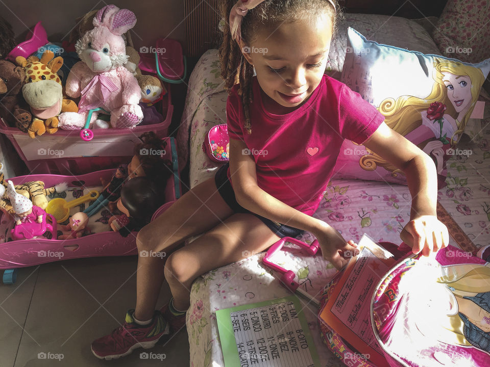 My daughter's daily routine tidying up school supplies before going to school