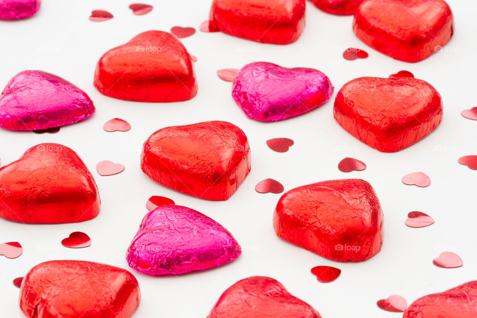Heart shaped Valentine&#x27;s Day chocolates on an isolated white background.